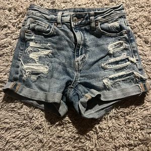 American eagle Jean shorts. Dark wash with rips and has been worn. Size 000